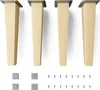 Four wooden furniture legs with metal mounting plates are displayed, along with two sets of square gray pads and a collection of screws. Produktbild-Vorschau