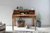 A wooden secretary desk with various items on and around it, set against a textured wall. Produktbild-Vorschau