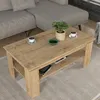 A coffee table with items on it, placed in a living room setting. Produktbild-Vorschau
