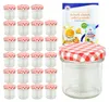 A set of glass jars with red and white checkered lids, along with a recipe booklet. Produktbild-Vorschau