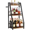 A three-tiered shelf unit filled with bottles of wine and spirits. Produktbild-Vorschau