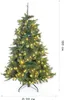 A full shot of a green artificial Christmas tree with lights, standing on a white background. Produktbild-Vorschau