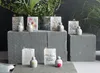 A collection of decorative Easter-themed items, including small bags and bunny figures, arranged on stone blocks. Produktbild-Vorschau