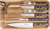 A set of barbecue utensils neatly arranged on a wooden cutting board. Produktbild-Vorschau