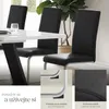 A dining set with black chairs and a white table. Náhled obrázku produktu
