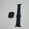 An Apple Watch and its band are laid out on a white background. Anteprima dell’immagine prodotto