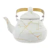 A white and gold marbled teapot on a white background. Podgląd zdjęcia produktu