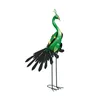 A decorative metal peacock sculpture on a white background. Produktbild-Vorschau