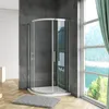 A modern bathroom with a curved glass shower enclosure. Produktbild-Vorschau