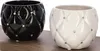 Two decorative ceramic pots, one black and one white, with diamond-patterned texture and small rhinestones, placed on a wooden surface. Produktbild-Vorschau