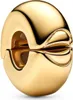A close-up studio shot of a gold Pandora charm clip. Podgląd zdjęcia produktu