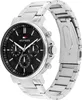 A close-up studio shot of a Tommy Hilfiger analog watch with a black dial and silver metal band. Produktbild-Vorschau