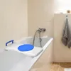 A bath board with a blue seat and a blue handle is placed across a bathtub. Náhľad obrázku produktu