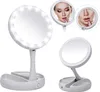 A white, foldable makeup mirror with LED lights is shown from multiple angles, with close-ups of a woman's face reflected in smaller mirrors. Náhľad obrázku produktu