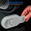 A hand is shown inserting a remote control into a fan. Produktbild-Vorschau