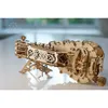 A wooden 3D puzzle model of a hurdy-gurdy on a reflective surface. Produktbild-Vorschau