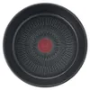A top-down view of the interior of a black frying pan with a distinctive red circular logo in the center and a radiating pattern of lines. Anteprima dell’immagine prodotto