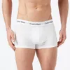 A man wearing white Calvin Klein boxer briefs. Produktbild-Vorschau