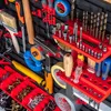 A close-up, overhead view of a tool board filled with various tools and hardware. Náhled obrázku produktu