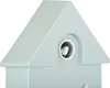 A close-up view of a light blue cuckoo clock shaped like a house, with a small white bird peeking out of a circular opening. Náhled obrázku produktu