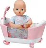 A baby doll sitting in a pink bathtub with a shower attachment. Produktbild-Vorschau
