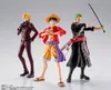 Three anime action figures of characters from One Piece standing against a light gray background. Podgląd zdjęcia produktu
