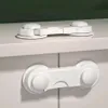 Two child safety locks are shown on white cabinets. Voir les images du produit