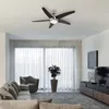A modern living room with a ceiling fan, sofa, chair, plant, and entertainment unit. Produktbild-Vorschau