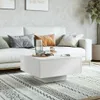 A modern living room scene with a white couch and a white coffee table. Voir les images du produit