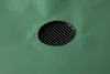 A close-up view of a black mesh drain cover in a green surface, possibly a water tank. Produktbild-Vorschau