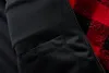 Close-up view of the inside lining and zipper of a jacket with a red and black plaid pattern. Produktbild-Vorschau