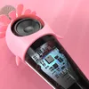 A close-up view of a pink karaoke microphone with a visible speaker and internal circuitry. Produktbild-Vorschau