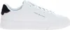 A white Tommy Hilfiger sneaker with black and red accents on a white background. Voir les images du produit