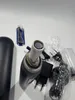 A close-up view of the top of an electric toothbrush, showing the charging port and some accessories. Produktbild-Vorschau