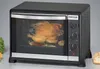 A countertop oven with a roasted chicken inside. Náhľad obrázku produktu