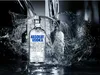 A bottle of Absolut Vodka is shown in a dramatic splash of water. Produktbild-Vorschau