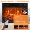 A hand holding a remote control in front of an electric fireplace with simulated flames. Voir les images du produit