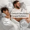 A man and a child sleeping peacefully in bed, covered by a weighted blanket. Produktbild-Vorschau