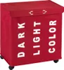 A red laundry sorter with three compartments, labeled 'DARK', 'LIGHT', and 'COLOR'. It has a lid and wheels. Náhľad obrázku produktu