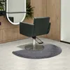 A salon chair sits on a semi-circular anti-fatigue mat in front of a wooden wall and a mirror. Náhled obrázku produktu