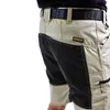 Close-up of the lower torso and upper legs of a person wearing work shorts. Produktbild-Vorschau