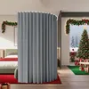 A bedroom decorated for Christmas with a large gray room divider curtain. Produktbild-Vorschau
