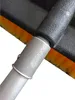 Close-up of the connection point between a telescopic handle and a brush head. Náhľad obrázku produktu