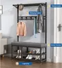 A coat rack with a shoe bench, displaying various clothing items and shoes. Produktbild-Vorschau