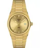A close-up, front-facing studio shot of a gold Tissot PRX watch against a white background. Anteprima dell’immagine prodotto