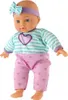 A baby doll wearing a striped shirt and heart-patterned pants, with a bow on its head. Podgląd zdjęcia produktu