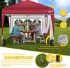 A family is enjoying a meal under a red pop-up gazebo in a grassy yard. Anteprima dell’immagine prodotto
