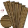 A fan of wooden-textured panels arranged diagonally, with a close-up inset of the wood grain. Produktbild-Vorschau