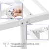 Close-up of a white metal bed frame assembly, showing how T-shaped brackets reinforce joints for stability. Produktbild-Vorschau