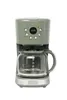 A green coffee maker with a glass carafe on a white background. Náhled obrázku produktu